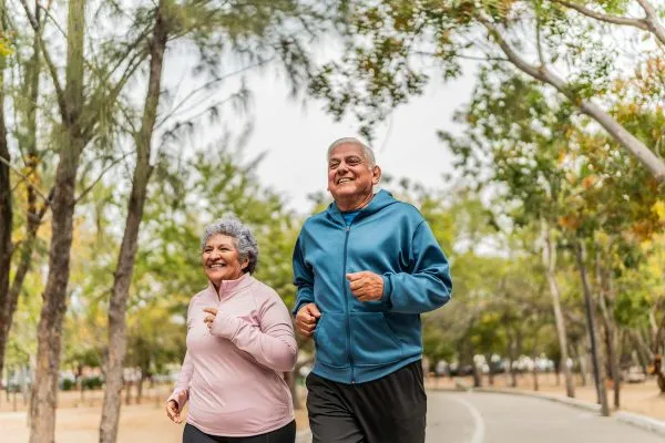 elderly couple running
